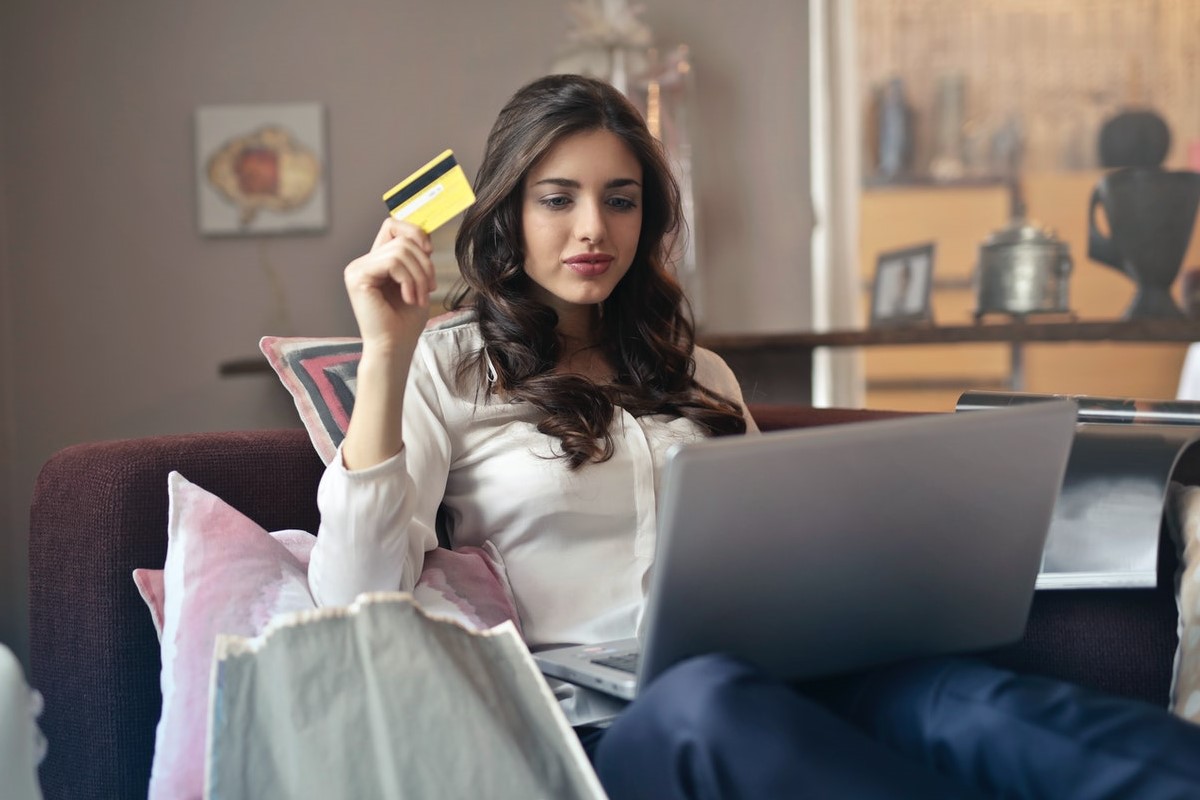 woman holding credit card